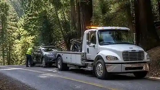 Tow truck providing towing service near Highway 9 in Boulder Creek, CA