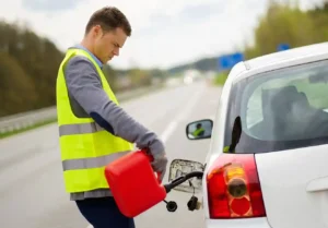 car stopped on the shoulder of a Santa Cruz County road with the fuel gauge on empty