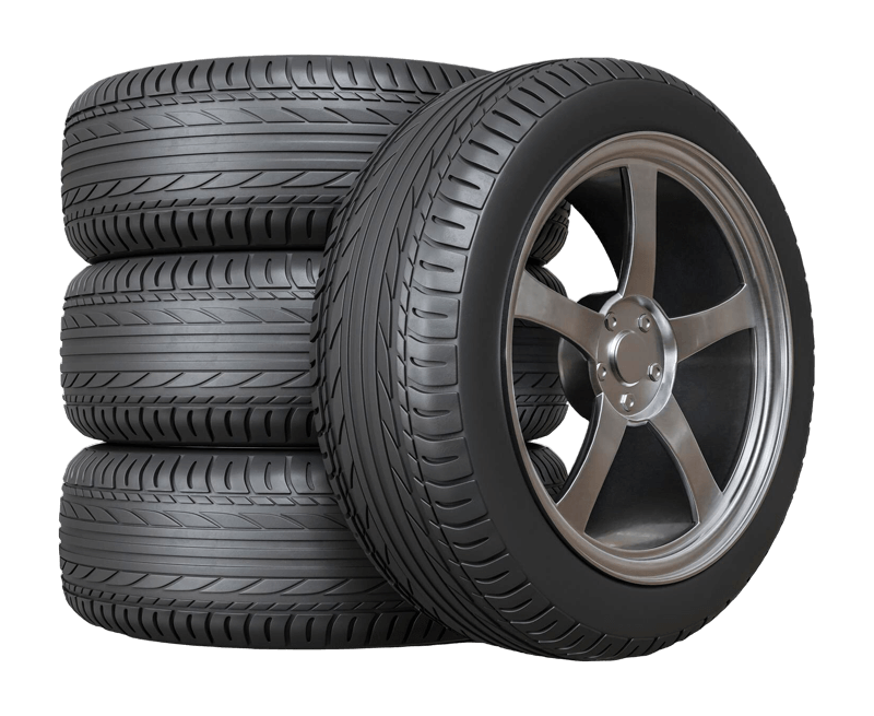 stack of four car tires with alloy wheels for flat tire service near Santa Cruz CA