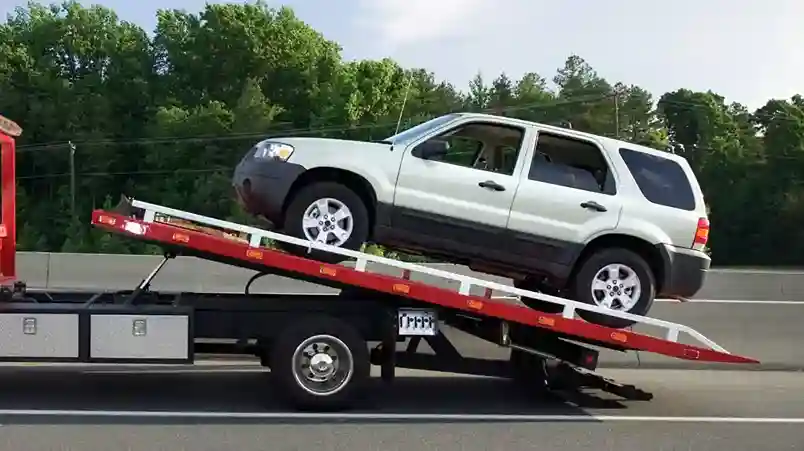 tow truck loading a car for towing in Capitola CA near 41st Avenue