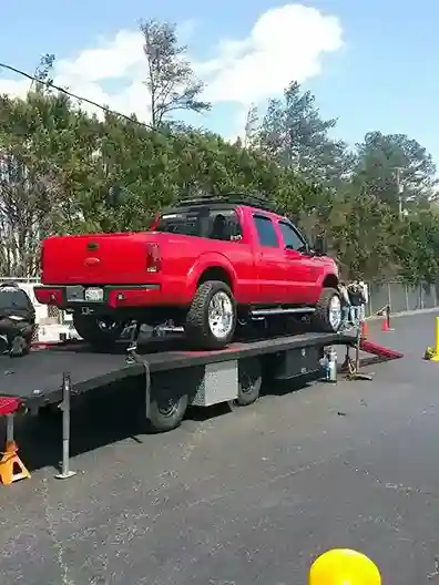 tow truck on Corralitos Road among apple orchards for towing in Corralitos CA